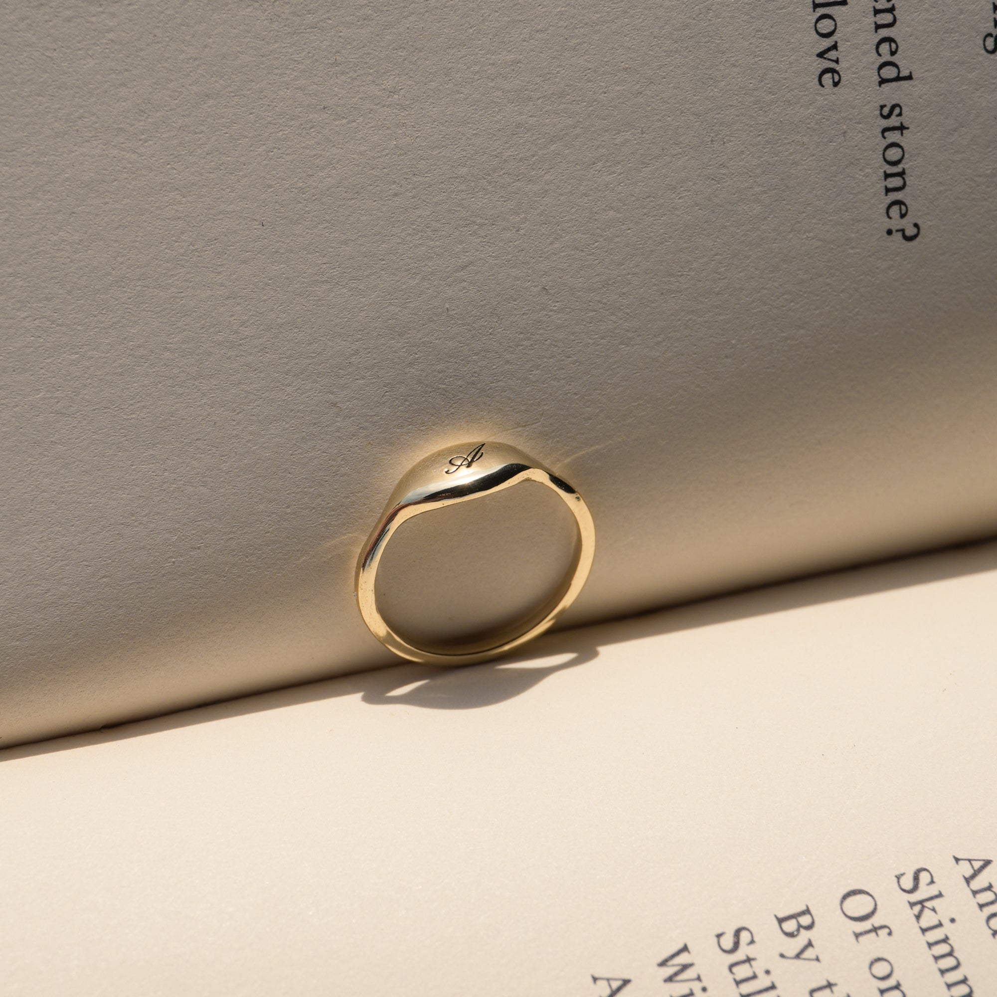 14k solid gold initial pinky ring with engraved letter on puffy signet face